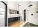 Modern bathroom with dual sink vanity, glass shower with luxury fixtures at 3911 Kamden Way, Las Vegas, NV 89119