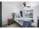 Comfortable bedroom with modern decor, featuring a ceiling fan and natural light from the window at 3911 Kamden Way, Las Vegas, NV 89119