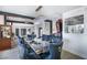 Unique dining area with luxurious navy blue chairs and elegant crystal chandelier lighting at 3911 Kamden Way, Las Vegas, NV 89119