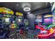 Finished arcade room featuring retro Batman arcade games and colorful carpet at 3911 Kamden Way, Las Vegas, NV 89119