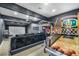 Finished game room with basketball arcade, projector and movie screen at 3911 Kamden Way, Las Vegas, NV 89119