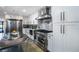 Bright modern kitchen features stainless steel appliances, large island and stylish backsplash at 3911 Kamden Way, Las Vegas, NV 89119