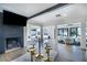 Open-concept living room featuring a fireplace and modern decor at 3911 Kamden Way, Las Vegas, NV 89119
