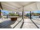 A spacious covered patio area with a view of the backyard and a pool at 3911 Kamden Way, Las Vegas, NV 89119