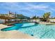 Inviting pool with bridge and tiki hut, perfect for outdoor entertaining at 3911 Kamden Way, Las Vegas, NV 89119