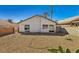 Open backyard featuring gravel landscaping, surrounded by brick wall at 4130 Lucas Ave, Las Vegas, NV 89120