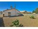 Wide angle of the low maintenance backyard, featuring cacti at 4130 Lucas Ave, Las Vegas, NV 89120