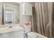 Bathroom featuring a vanity, toilet, and a shower-tub combo at 4130 Lucas Ave, Las Vegas, NV 89120