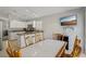Bright kitchen with open dining area featuring a granite counter and stainless steel appliances at 4130 Lucas Ave, Las Vegas, NV 89120