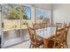 Dining room features tiled floors, backyard views and an adjacent sliding glass door at 4130 Lucas Ave, Las Vegas, NV 89120