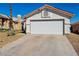 Single-story home showcasing a well-kept two-car garage and desert-style landscaping at 4130 Lucas Ave, Las Vegas, NV 89120