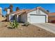 Inviting single-story home featuring a low-maintenance desert landscape and a two-car garage at 4130 Lucas Ave, Las Vegas, NV 89120