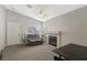 Cozy living room with neutral colors, a ceiling fan, and a fireplace at 4130 Lucas Ave, Las Vegas, NV 89120