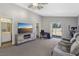 Large living room with TV, desk area and access to backyard at 4130 Lucas Ave, Las Vegas, NV 89120
