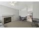 Bright living room featuring a fireplace, a ceiling fan and open access to the kitchen at 4130 Lucas Ave, Las Vegas, NV 89120