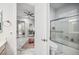 Contemporary bathroom features shower over tub and view of the bedroom at 47 Grand Masters Dr, Las Vegas, NV 89141
