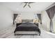 Spacious bedroom with marble floors, neutral tones, and large windows for natural light at 47 Grand Masters Dr, Las Vegas, NV 89141