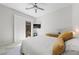 Bright bedroom featuring a ceiling fan and sliding glass door at 47 Grand Masters Dr, Las Vegas, NV 89141