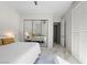 Modern bedroom featuring a sliding mirror door closet at 47 Grand Masters Dr, Las Vegas, NV 89141