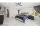Bedroom with marble floors, natural light from a window and easy access to an additional room at 47 Grand Masters Dr, Las Vegas, NV 89141