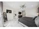 Bedroom boasts neutral tones, marble floors, and direct bathroom access for ease and convenience at 47 Grand Masters Dr, Las Vegas, NV 89141