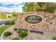 Stone monument sign welcomes to the Masters Collection in a well-maintained community at 47 Grand Masters Dr, Las Vegas, NV 89141