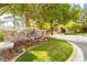 Stone entrance to Southern Highlands Spa featuring beautiful flowers and well-maintained landscaping at 47 Grand Masters Dr, Las Vegas, NV 89141