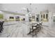 Spacious kitchen featuring marble floors, white cabinets, granite countertops, and stainless steel appliances at 47 Grand Masters Dr, Las Vegas, NV 89141