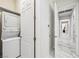 Efficient laundry area featuring stacked washer and dryer at 47 Grand Masters Dr, Las Vegas, NV 89141