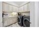 Functional laundry room with sink, washer, and dryer at 47 Grand Masters Dr, Las Vegas, NV 89141