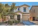 Charming two-story home with a well-maintained front yard and inviting curb appeal in a residential neighborhood at 517 Primrose Hill Ave, Las Vegas, NV 89178