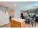 Open-concept kitchen featuring a center island, wood cabinets, seamlessly connects to the living space at 517 Primrose Hill Ave, Las Vegas, NV 89178
