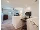 An open loft area features neutral carpeting, a ceiling fan, and two workstations with computer setups at 517 Primrose Hill Ave, Las Vegas, NV 89178