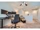 Home office or loft with computer, office chair, ceiling fan, and comfortable seating area at 517 Primrose Hill Ave, Las Vegas, NV 89178