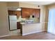 The kitchen has bright lighting, an adjacent breakfast bar and wooden cabinets at 530 Sellers Pl, Henderson, NV 89011