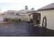 The backyard patio features a decorative concrete pad, as well as several chairs and outdoor heaters at 5381 Awbury Ave, Las Vegas, NV 89110