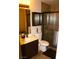 Bathroom featuring a vanity, toilet, and shower with glass door at 5381 Awbury Ave, Las Vegas, NV 89110