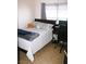 Cozy bedroom with a queen-sized bed and a desk for work or study at 5381 Awbury Ave, Las Vegas, NV 89110