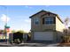 Lovely two-story home featuring a gated entrance, charming planters, and a convenient two-car garage at 5381 Awbury Ave, Las Vegas, NV 89110
