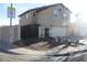 Inviting two-story home featuring a gated entrance, charming planters, and a convenient two-car garage at 5381 Awbury Ave, Las Vegas, NV 89110