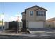 Attractive two-story home boasting a gated entrance, lush planters, and a practical two-car garage at 5381 Awbury Ave, Las Vegas, NV 89110