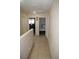 Upstairs hallway with tile flooring provides access to multiple bedrooms at 5381 Awbury Ave, Las Vegas, NV 89110