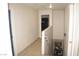 Hallway with tile flooring, connecting the living areas with stair access to lower level at 5381 Awbury Ave, Las Vegas, NV 89110