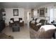 Inviting living room features tile flooring, comfortable seating and a neutral color palette at 5381 Awbury Ave, Las Vegas, NV 89110