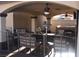 Enjoy outdoor living in this covered patio area with plenty of comfortable seating and ceiling fans at 5381 Awbury Ave, Las Vegas, NV 89110