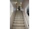 Tiled staircase with a handrail that provides access to the upper or lower levels of the home at 5381 Awbury Ave, Las Vegas, NV 89110