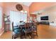 Open concept dining area with seating for six and access to the living room at 5528 Apache Wells Way, Las Vegas, NV 89130