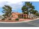 Well-maintained home with mature trees, desert landscaping, and inviting curb appeal on a corner lot at 5528 Apache Wells Way, Las Vegas, NV 89130