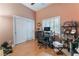 Home office with computer, ceiling fan, blinds, and tile floor at 5528 Apache Wells Way, Las Vegas, NV 89130