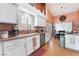 Bright kitchen with white cabinets, stainless steel appliances, and access to the dining area at 5528 Apache Wells Way, Las Vegas, NV 89130